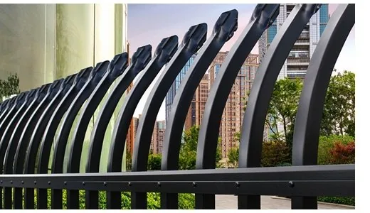 Close up of curved top steel pickets on metal security fence