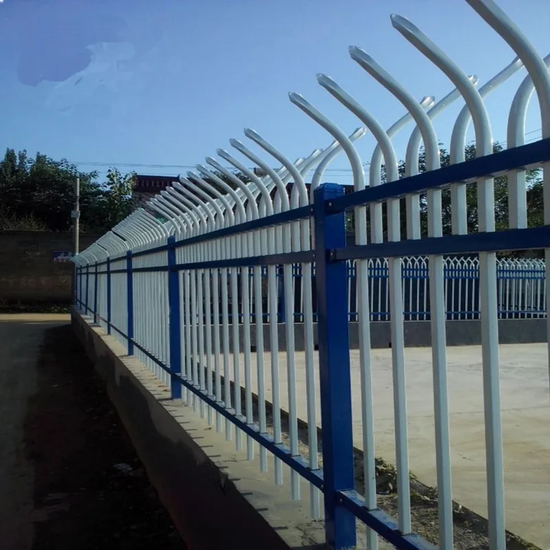 Blue and white curved top steel fence installed on site