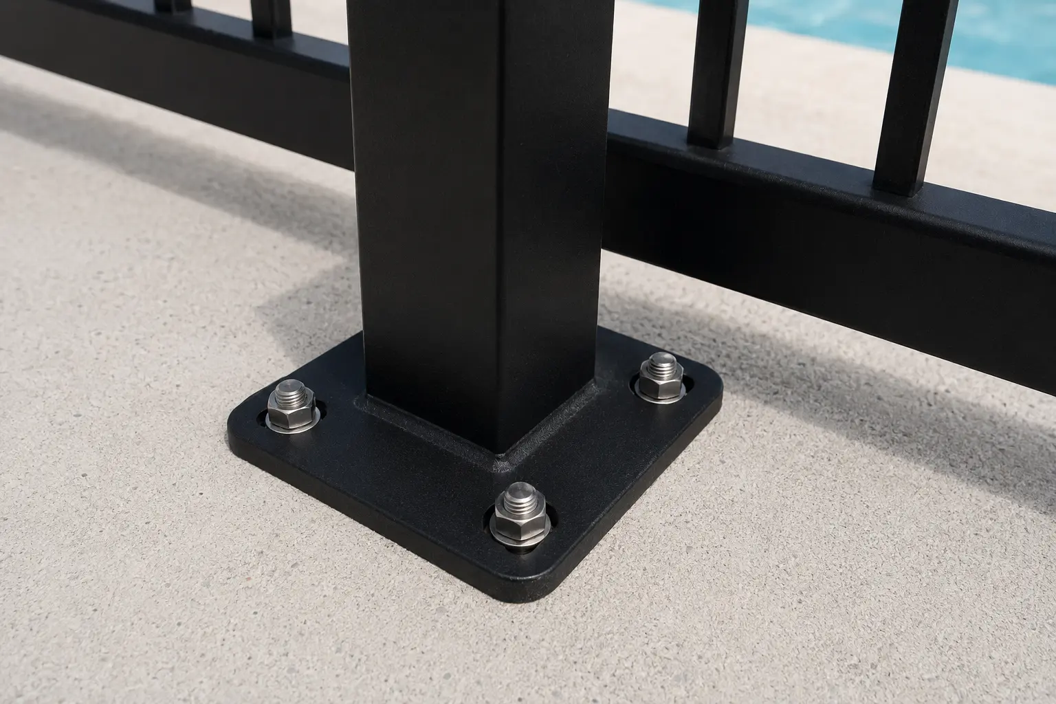 Aluminium pool fence post base plate fixed to concrete with anchor bolts