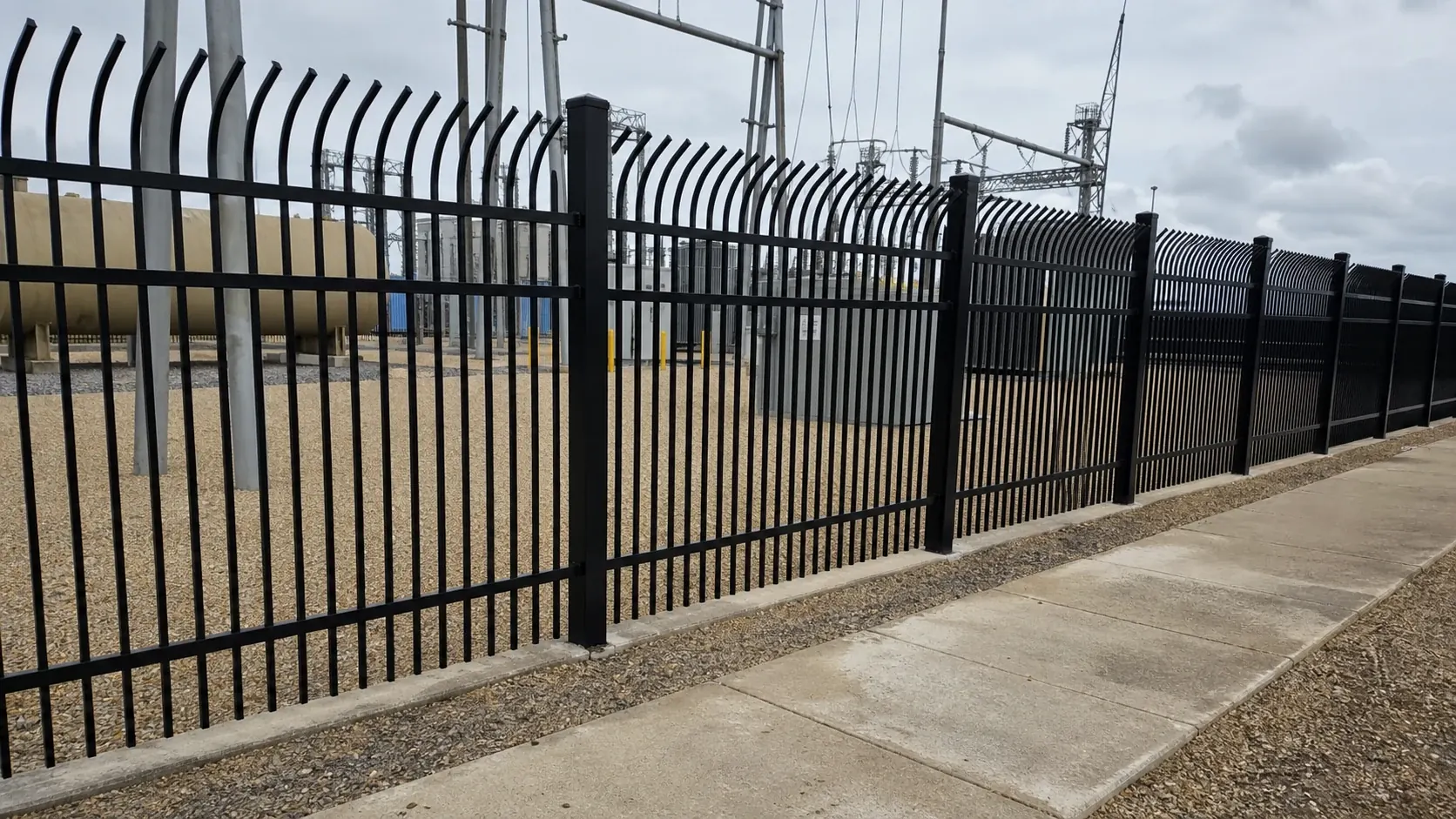 completed bent top metal security fence site installation for utility yard