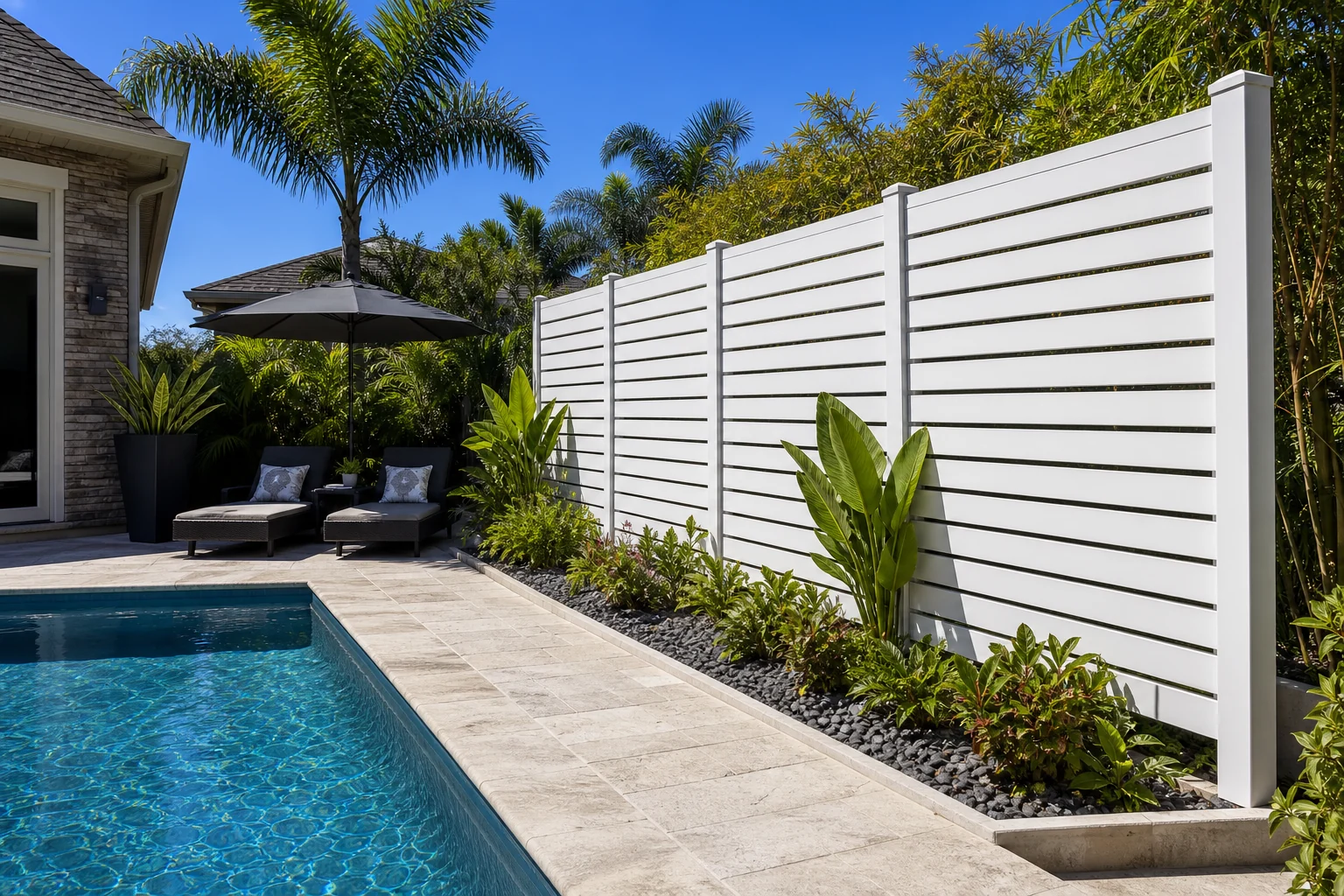 White aluminum semi privacy fence panels used as a poolside privacy screen