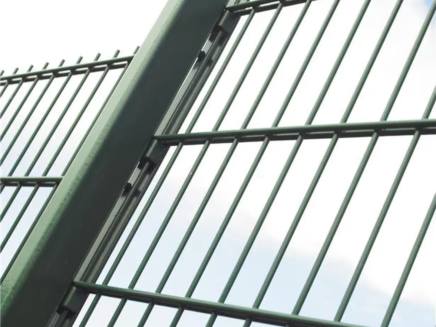 Double wire fence post clamp and bolt fixing detail in an installation scene